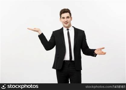 Business Concept: Attractive handsome business man shows hand on side. Copy space on white background.. Business Concept: Attractive handsome business man shows hand on side. Copy space on white background