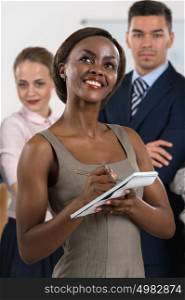 Business concept - attractive young african businesswoman in office