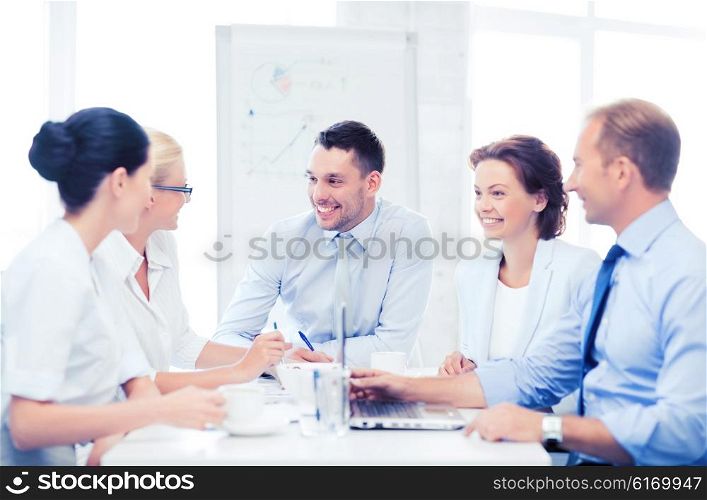 business concept - business team having meeting in office. business team having meeting in office
