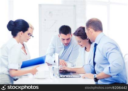 business concept - business team having meeting in office. business team having meeting in office