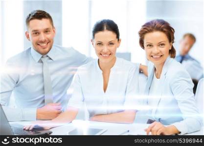 business concept - business team working with tablet pc and laptop in office