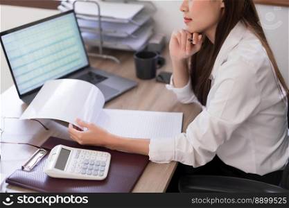 Business concept, Businesswoman reading business document to analysis investment budget of project.