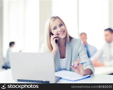business concept - businesswoman talking on the phone in office. businesswoman with phone in office