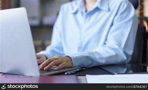 Business concept, Businesswomen working and typing marketing plan data on laptop in workplace.