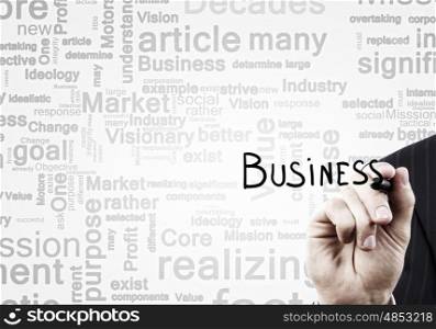 Business concept. Close up of businessman writing word business on screen