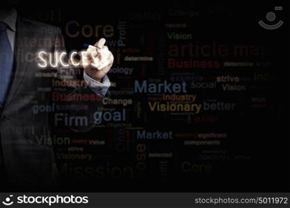 Business concept. Close up of businessman writing word success on screen