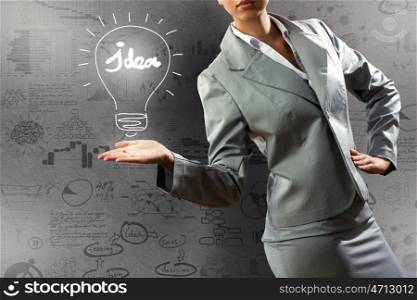 Business concept. Close up of businesswoman with sketches at background