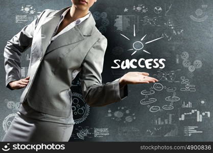 Business concept. Close up of businesswoman with sketches at background