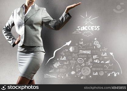 Business concept. Close up of businesswoman with sketches at background