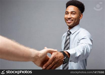 Business concept - Close-up of two confident business people shaking hands during a meeting. Business concept - Close-up of two confident business people shaking hands during a meeting.