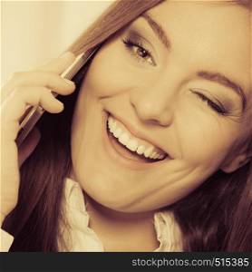 business concept. Closeup modern happy businesswoman woman fashionable girl talking on the mobile phone smartphone, winking. Aged warm tone
