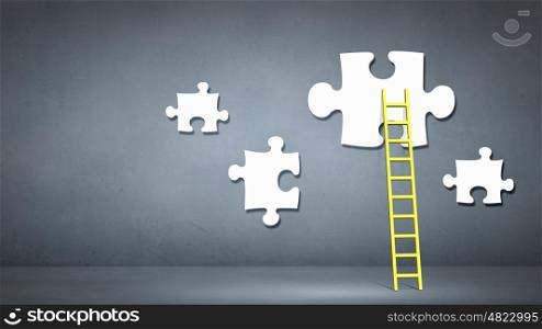 Business concept. Conceptual image of ladder leading to puzzle element