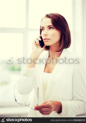 business concept - confused woman with smartphone