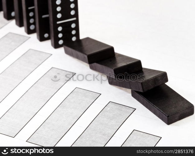 business concept - fallen domino and falling economy diagram