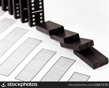 business concept - fallen domino and falling economy diagram