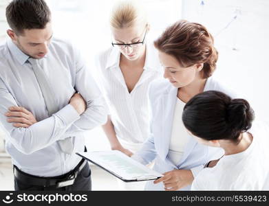 business concept - friendly business team having discussion in office