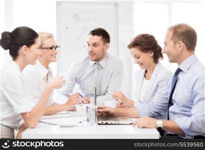 business concept - friendly business team having meeting in office