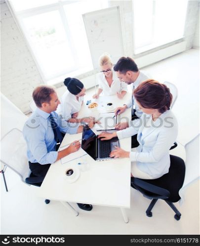 business concept - friendly business team having meeting in office. business team having meeting in office