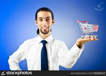 Business concept - Hands holding shopping cart