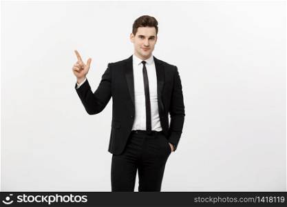 Business Concept: Handsome businessman with a finger pointed up isolated over white background.. Business Concept: Handsome businessman with a finger pointed up isolated over white background