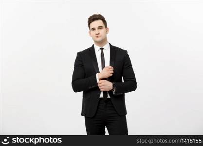 Business Concept: Handsome Man Happy Smile Young Handsome Guy in smart suit posing over Isolated Grey Background. Business Concept: Handsome Man Happy Smile Young Handsome Guy in smart suit posing over Isolated Grey Background.