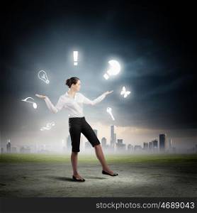 Business concept. Image of businesswoman juggling with sign and symbols