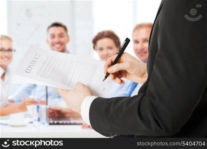 business concept - man signing contract