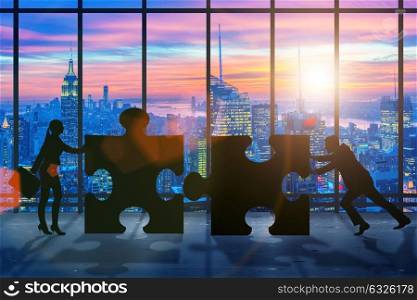 Business concept of teamwork with jigsaw puzzle