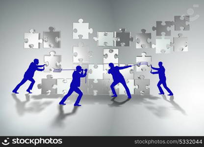 Business concept of teamwork with puzzle pieces