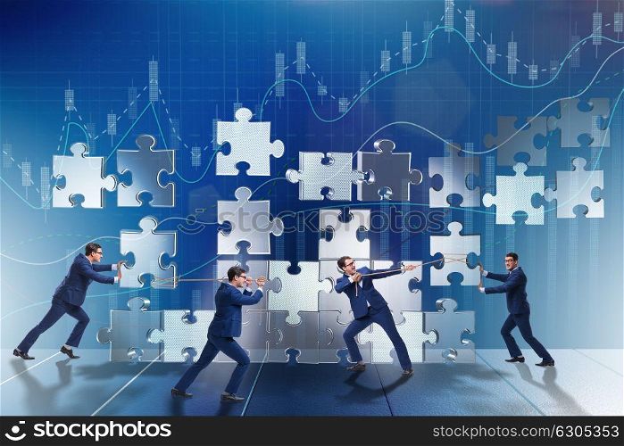 Business concept of teamwork with puzzle pieces