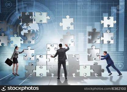 Business concept of teamwork with puzzle pieces