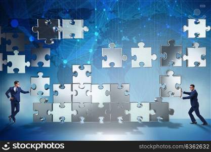 Business concept of teamwork with puzzle pieces