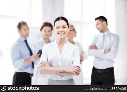 business concept - picture of smiling attractive businesswoman in office
