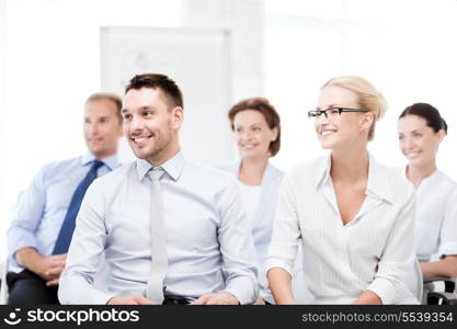 business concept - picture of smiling businessmen and businesswomen on conference