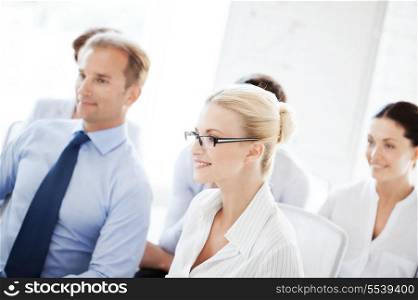 business concept - picture of smiling businessmen and businesswomen on conference