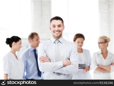 business concept - picture of smiling handsome businessman in office