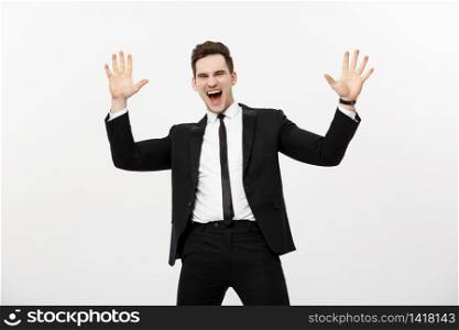 Business Concept: Portrait handsome businessman expressing surprise and joy raising his hands, isolated over white background. Business Concept: Portrait handsome businessman expressing surprise and joy raising his hands, isolated over white background.