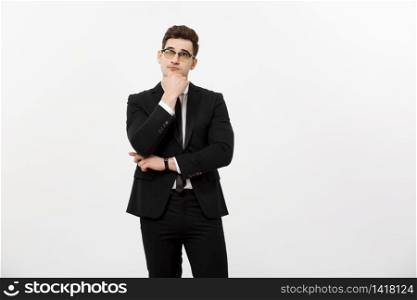 Business Concept: Portrait of Thoughtful handsome Businessman wearing smart suit in thinking gesture isolated over white background. Business Concept: Portrait of Thoughtful handsome Businessman wearing smart suit in thinking gesture isolated over white background.