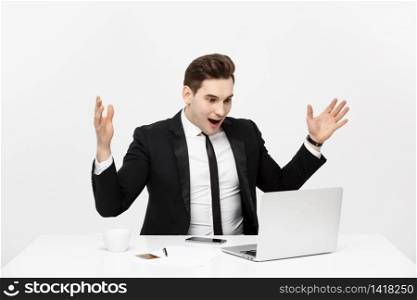 Business Concept: Portrait surprised businessman in black suit looking at camera. Front view. Isolated gray background.. Business Concept: Portrait surprised businessman in black suit looking at camera. Front view. Isolated gray background