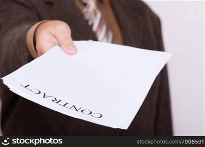 Business concept signing contract. Businessman giving blank empty paper sheet with sign contract and space for text.