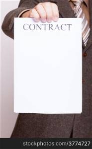 Business concept signing contract. Businessman holding blank empty paper sheet with sign contract and space for text.
