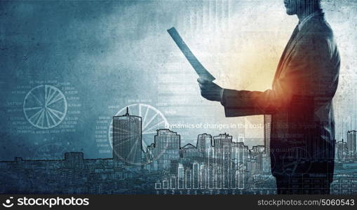 Business concept. Silhouette of businessman with papers in hand