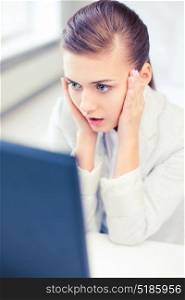business concept - stressed businesswoman with computer in office. stressed businesswoman with computer