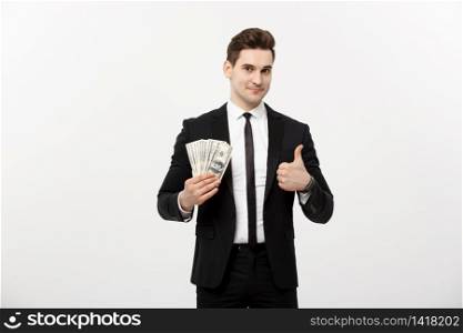 Business Concept - Successful Businessman holding dollar bills and showing thumb up isolated over white background. Business Concept - Successful Businessman holding dollar bills and showing thumb up isolated over white background.