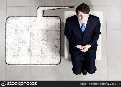Business concept. Top view of businessman sitting on chair