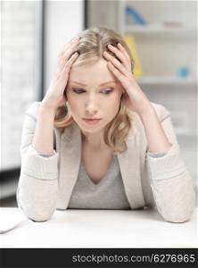 business concept - unhappy woman in office