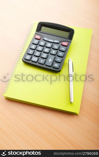 Business concept with notepad and calculator