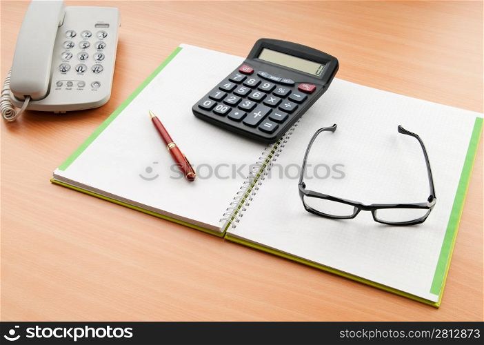 Business concept with notepad and calculator