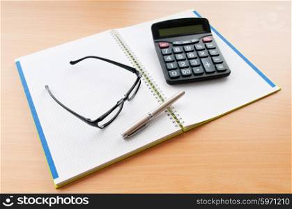 Business concept with notepad and calculator