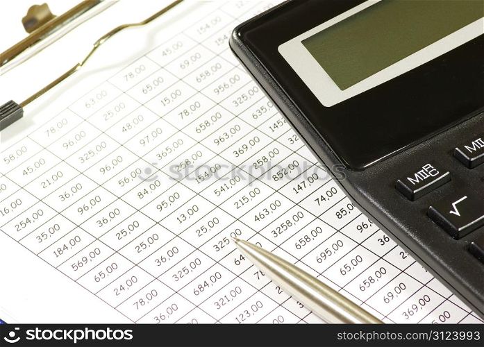 Business concept with pen and calculator